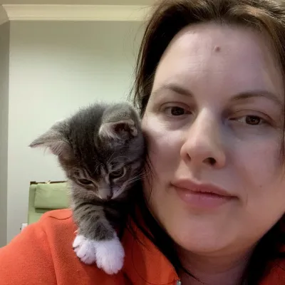 Anna with Karamelka as a kitten on her shoulder